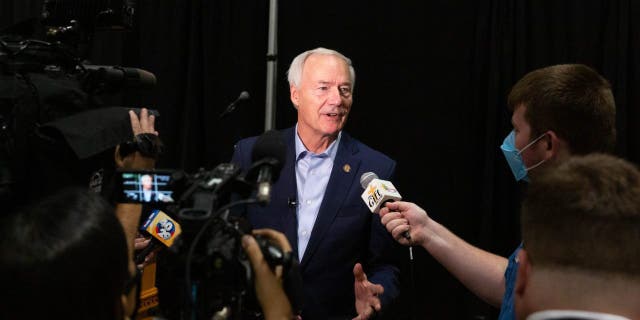 Asa Hutchinson, governor of Arkansas, speaks with members of the media on Monday, July 16, 2021.  Photographer: Liz Sanders/Bloomberg via Getty Images