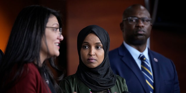 Reps. Rashida Tlaib, left, Ilhan Omar and Jamaal Bowman return questions during a news convention connected Capitol Hill connected Nov. 30, 2021. 