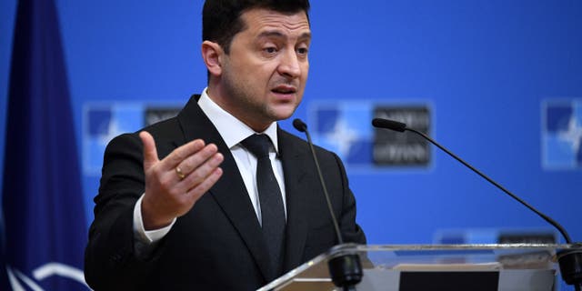 Ukrainian President Volodymyr Zelensky talks during a press conference in Brussels Dec. 16, 2021.