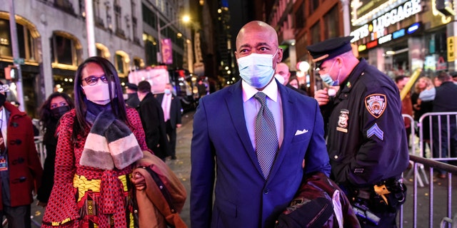 Eric Adams, incoming mayor of New York, right, arrives at a New Year's Eve celebration in the Times Square area of New York, U.S., on Friday, Dec. 31, 2021. Photographer: Stephanie Keith/Bloomberg via Getty Images