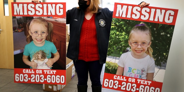 Manchester Police Public Information Officer Heather Hamel holds two reward posters at the police station showing photos of missing Harmony Montgomery in Manchester, NH on Jan. 4, 2022. 