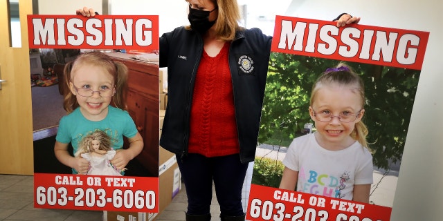 Manchester Police Public Information Officer Heather Hamel holds two reward posters at the police station showing photos of missing Harmony Montgomery in Manchester, NH on Jan. 4, 2022. 