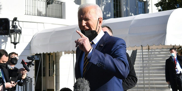 US President Joe Biden speaks with reporters on the South Lawn before departing from the White House on Marine One on Jan. 11, 2022 in Washington, D.C.