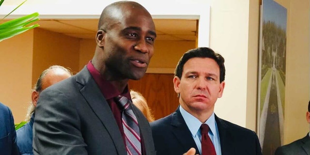 Florida Surgeon General Joseph Ladapo and Gov. Ron DeSantis at a news conference in West Palm Beach, Florida, on Jan. 6, 2022.