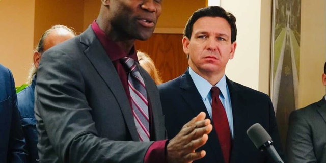 Florida Surgeon General Joseph Ladapo and Gov. Ron DeSantis at a news conference in West Palm Beach, Florida, on Jan. 6, 2022.