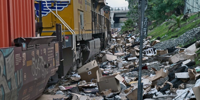 Packaging debris and items stolen from rail cars litter train tracks near the the Union Pacific rail yard in Lincoln Heights on January 15, 2022 in Los Angeles, CA.