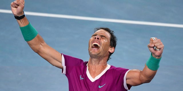 Spain's Rafael Nadal reacts after defeating Russia's Daniil Medvedev during their men's singles final match on day fourteen of the Australian Open tennis tournament in Melbourne Jan. 31, 2022.