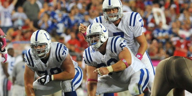 Quarterback Curtis Painter #7 of the Indianapolis Colts sets for a play behind center Jeff Saturday #63 against the Tampa Bay Buccaneers October 3, 2011 at Raymond James Stadium in Tampa, Florida.