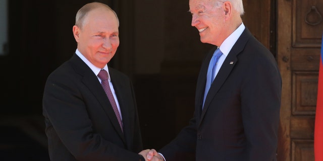 Vladimir Putin greets President Joe Biden during the U.S.-Russia summit on June 16, 2021, in Geneva, Switzerland. (Mikhail Svetlov/Getty Images)