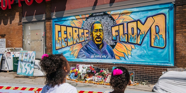 A mural of George Floyd painted on the side of the Cup Foods near where he was killed in Minneapolis on May 25, 2020. 