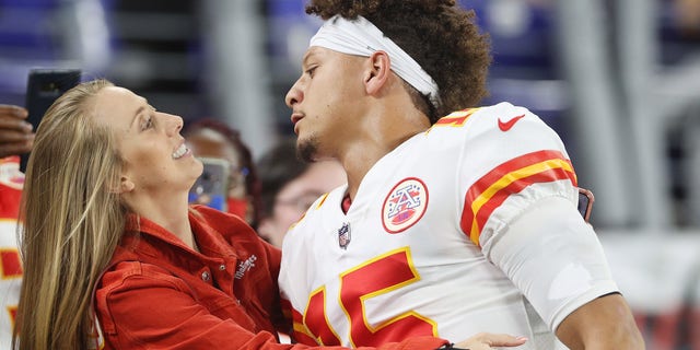 Patrick Mahomes of the Kansas City Chiefs greets fiancee Brittany Matthews prior to a game against the Baltimore Ravens Sept. 19, 2021, in Baltimore.