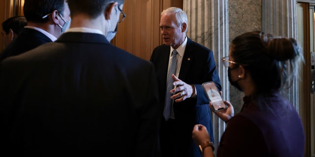 Sen. Ron Johnson speaks with reporters after attending a luncheon with Senate Republicans at the U.S. Capitol on Oct. 7, 2021.
