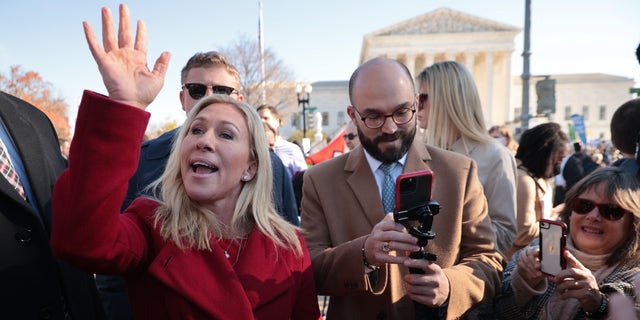 Rep. Marjorie Taylor Greene (R-GA) joins fellow anti-abortion activists in front of the U.S. Supreme Court as the justices hear hear arguments in Dobbs v. Jackson Women's Health, a case about a Mississippi law that bans most abortions after 15 weeks, on December 01, 2021 in Washington, DC. 