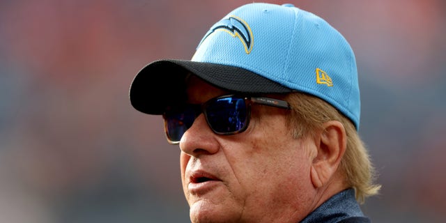 Dean Spanos, owner of the Los Angeles Charges, visits the sidelines before a game against the Denver Broncos at Empower Field At Mile High Nov. 28, 2021, in Denver. 