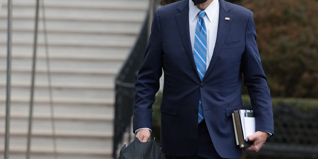 President Biden walks to speak with reporters on the South Lawn before departing from the White House on Marine One on Dec. 27, 2021 in Washington. 