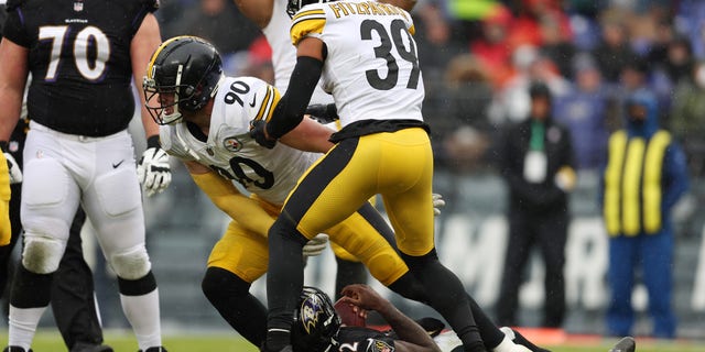 T.J. Watt of the Pittsburgh Steelers sacks Baltimore Ravens quarterback Tyler Huntley during the second quarter of their game at M and T Bank Stadium in Baltimore, Maryland, on Jan. 9, 2022.