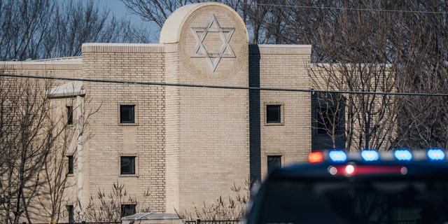 A law enforcement vehicle sits in front of the Congregation Beth Israel synagogue on January 16, 2022 in Colleyville, Texas. 