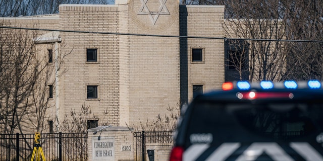 A law enforcement vehicle sits in front of the Congregation Beth Israel synagogue on January 16, 2022 in Colleyville, Texas.