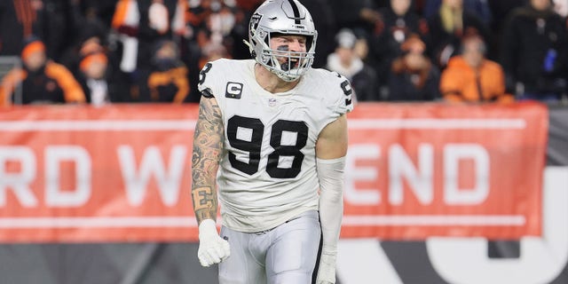 Maxx Crosby #98 of the Las Vegas Raiders celebrates against the Cincinnati Bengals during the AFC Wild Card Playoff game at Paul Brown Stadium on January 15, 2022 in Cincinnati, Ohio.