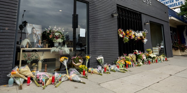 LOS ANGELES, CALIFORNIA - JANUARY 17: Flowers are placed outside Croft House furniture store in memory of graduate student Brianna Kupfer. Kupfer was stabbed to death by an unknown assailant while working in the store on Thursday January 13th in Los Angeles. (Photo by Emma McIntyre/Getty Images)