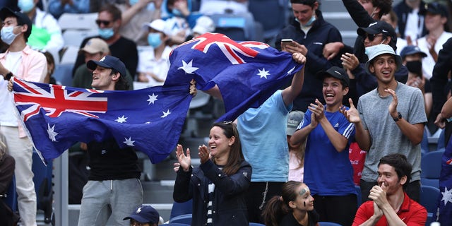 Fans cheer during the round one singles match match between Nick Kyrgios of Australia and Liam Broady of Great Britain during day two of the 2022 Australian Open at Melbourne Park on Jan. 18, 2022 in Melbourne, Australia.