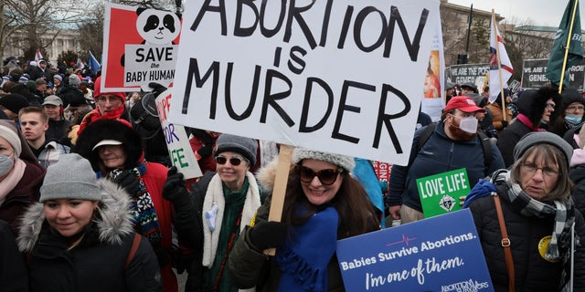 Anti-abortion activists participate in the 49th annual March for Life as they march past the U.S. Supreme Court Jan. 21, 2022, in Washington, D.C. (Win McNamee/Getty Images)