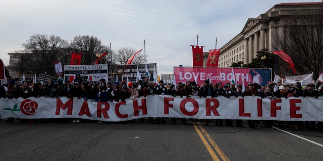 WASHINGTON, DC - JANUARY 21, 2022: Anti-abortion activists marched during the 49th annual March for Life rally on the National Mall. The rally was the last one before the U.S. Supreme Court voted to overturn the Roe v. Wade decision that legalized abortion nationwide. (Photo by Anna Moneymaker/Getty Images)