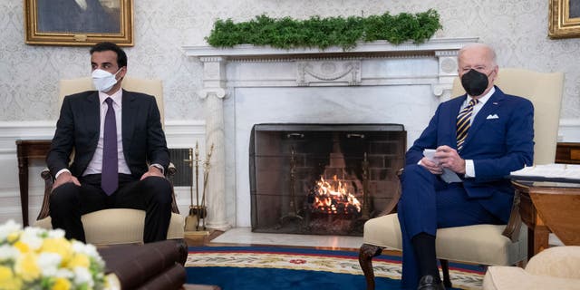 President Joe Biden meets with Sheikh Tamim Bin Hamad Al-Thani, Emir of the State of Qatar, in the Oval Office at the White House on Jan. 31, 2022 in Washington, D.C. (Photo by Tom Brenner-Pool/New York Times/Getty Images)