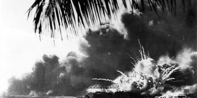 The American destroyer USS Shaw explodes during the Japanese attack on Pearl Harbor during World War II, 7th December 1941.  