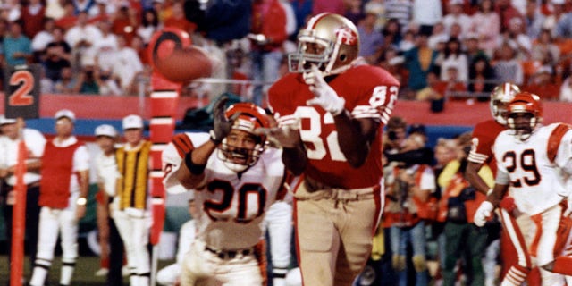 Wide receiver John Taylor #82 of the San Francisco 49ers catches the game-winning 10-yard touchdown reception in the final moments of the 49ers 20-16 victory over the Cincinnati Bengals in Super Bowl XXIII on January 22, 1989 at Joe Robbie Stadium in Miami, Florida.  