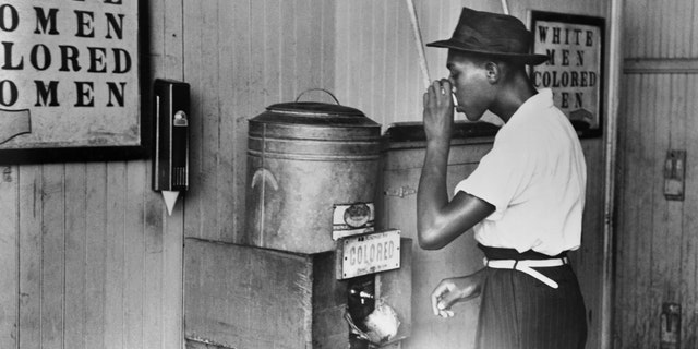 Segregated drinking fountain in a streetcar terminal in Oklahoma City, 1939. 