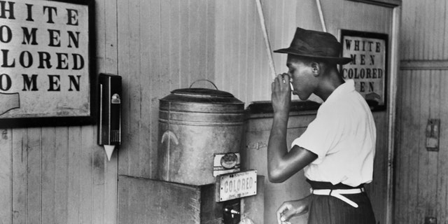 Segregated drinking fountain in a streetcar terminal in Oklahoma City, 1939.