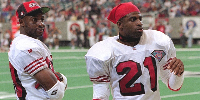 Jerry Rice (80) and Deion Sanders (21) of the San Francisco 49ers at the Georgia Dome in Atlanta. (Getty Images)