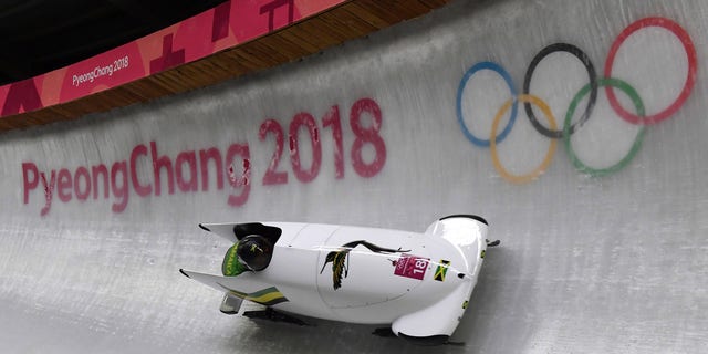 Jamaica's Jazmine Fenlator-Victorian and Jamaica's Carrie Russell compete in the women's bobsled heat at the Winter Olympic Games, Feb. 20, 2018, in South Korea.