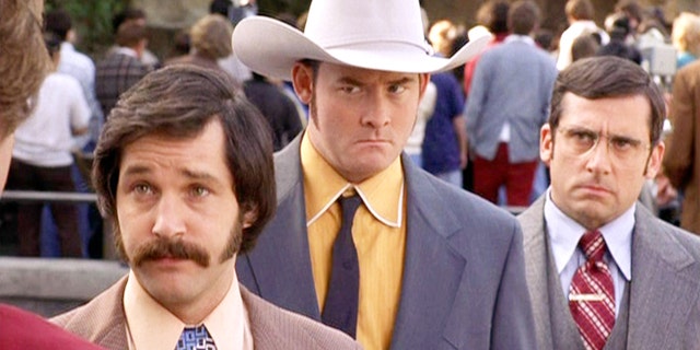 The film "Presenter: The Legend of Ron Burgundy", directed by Adam McKay.  Seen here are Channel 4 News team from left, Paul Rudd as Brian Fantana, David Koechner as Champ Kind and Steve Carell as Brick Tamland.  First theatrical release, July 9, 2004. 