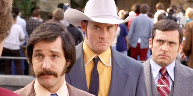 The movie "Anchorman: The Legend of Ron Burgundy", directed by Adam McKay. Seen here, the Channel 4 News team from left, Paul Rudd as Brian Fantana, David Koechner as Champ Kind and Steve Carell as Brick Tamland. Initial theatrical release, July 9, 2004. 