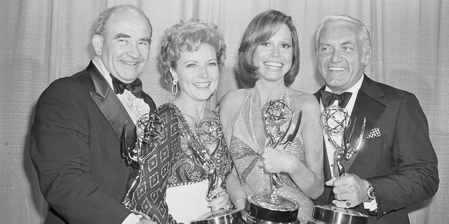 (Original Caption) Mary Tyler Moore and her weekly comedy series won five Emmys at the 28th Annual Television Academy Awards. Show regulars (left to right) Edward Asner, Betty White, Mary Tyler Moore and Ted Knight.