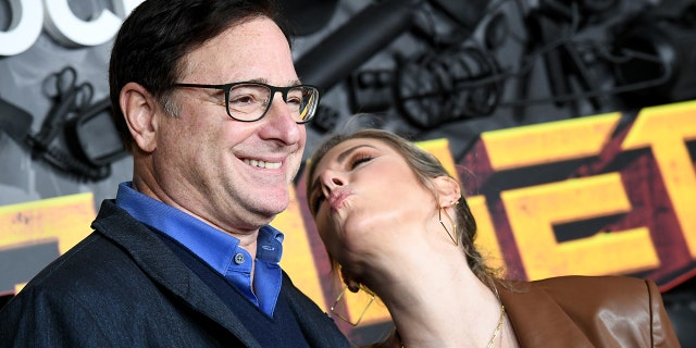 Bob Saget and Kelly Rizzo attend the red carpet premiere and party for Peacock's new comedy series ‘MacGruber’ at California Science Center on December 08, 2021, in Los Angeles, California.