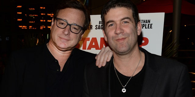 Actor Bob Saget (left) and director Mike Young attend the premiere for The Orchard's 'A Stand Up Guy' on Feb. 9, 2016, in Los Angeles, California. 