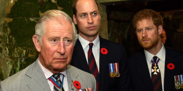 Prince Charles with his sons Prince William (center) and Prince Harry.