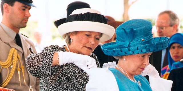 Queen Elizabeth II (right) with her lady-in-waiting, Lady Farnham.