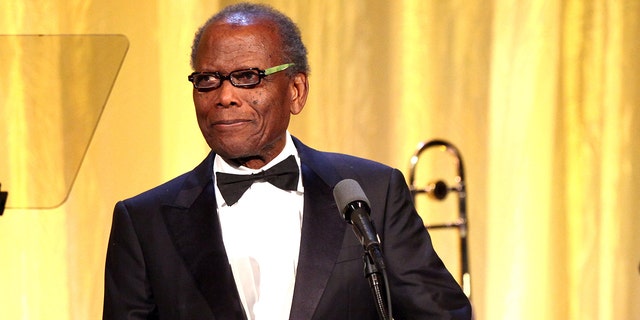 Actor Sidney Poitier speaks on stage at the YWCA Greater Los Angeles Rhapsody Ball held at the Regent Beverly Wilshire Hotel on November 14, 2014, in Beverly Hills, California. 