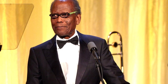 Actor Sidney Poitier speaks on stage at the YWCA Greater Los Angeles Rhapsody Ball held at the Regent Beverly Wilshire Hotel on November 14, 2014, in Beverly Hills, California.