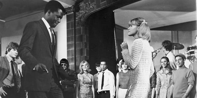 Sidney Poitier dances with one of his students in a still from the film ‘To Sir, with Love’.