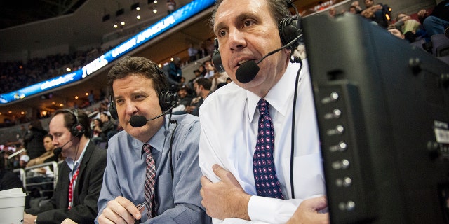Wiz radio announcers, play by play man Dave Johnson center left, and color man Glenn Consor, right, keep their eye on the game that pits the Washington Wizards against the Golden State Warriors at the Verizon Center Feb. 24, 2015 in Washington, DC.