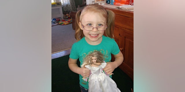 Harmony is about 4 feet tall and weighs around 50 pounds. She has blond hair and blue eyes. Because of visual impairments, she should be wearing glasses. She’s blind in her right eye.