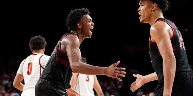 Stanford forward Harrison Ingram, second from left, celebrates with forward Spencer Jones after forcing a turnover during the second half of an NCAA college basketball game against Southern California Thursday, Jan.. 27, 2022, in Los Angeles.