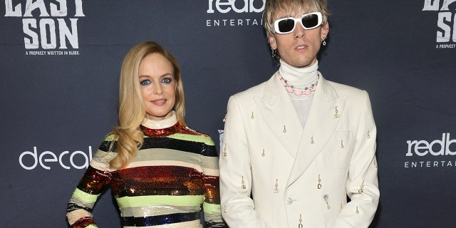 Heather Graham and Machine Gun Kelly, real name Colson Baker, starred alongside each other in ‘The Last Son.’ The film was released last month and Graham is already onto her next project, a psychological horror film titled, ‘Oracle,’ which is filmed in New Orleans.