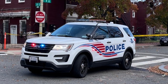 A Metropolitan Police SUV parks near police tape in Washington, D.C.