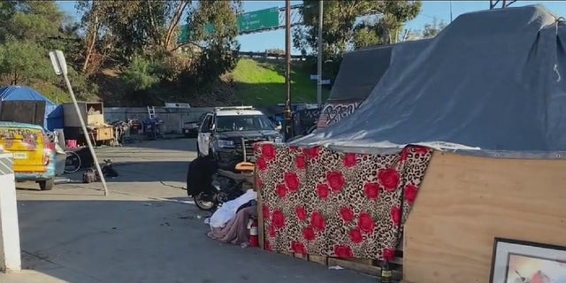 A homeless encampment near SoFi Stadium in Inglewood, California was cleared out Tuesday. The venue is slated to host Super Bowl LVI on Feb. 13. 